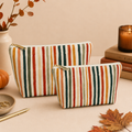 Striped Makeup Bag Travel Organizer Zippered Cosmetic Pouch Portable Beauty Storage Wrist Strap Design Gold Zipper Closure Toiletry Case Perfect Travel Companion Polyester Construction Multi Color Pattern Rust Orange Mustard Yellow Forest